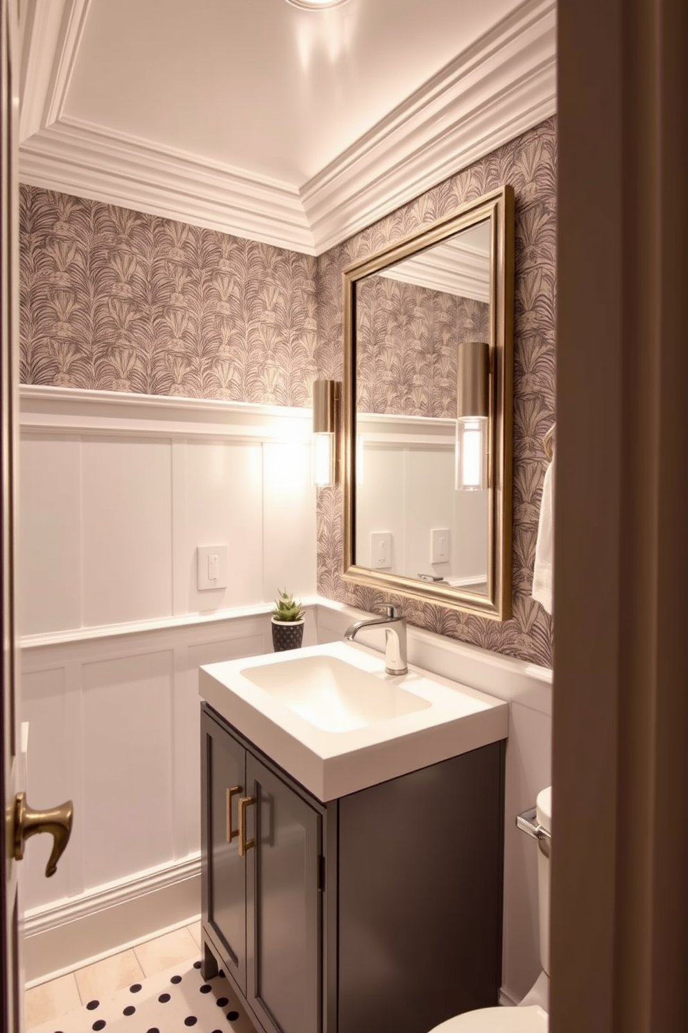 A trendy powder room features elegant crown molding that adds a polished finish to the space. The walls are adorned with a chic wallpaper pattern that complements the stylish fixtures and accessories. The vanity is a sleek modern design with a deep sink and a polished chrome faucet. A statement mirror hangs above the vanity, reflecting the ambient lighting that creates a warm and inviting atmosphere.