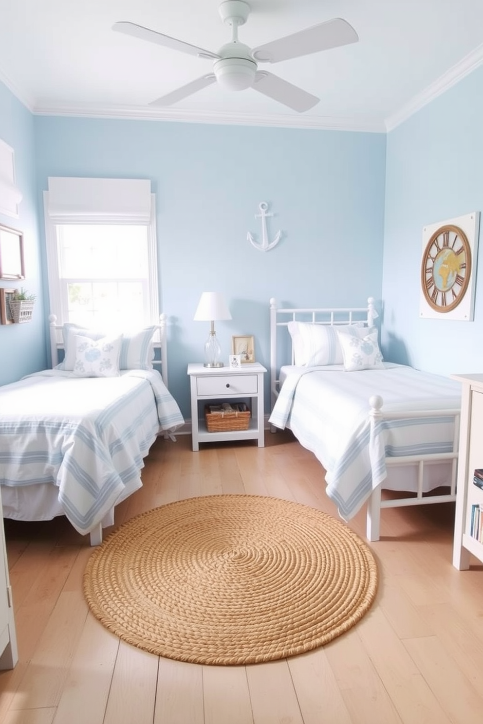 A serene twin bedroom designed with beachy vibes. The walls are painted in a soft light blue, complemented by white bedding and nautical-themed decor. Two twin beds are positioned against opposite walls, each adorned with light blue and white striped bedspreads. A woven jute rug lies in the center, adding warmth and texture to the space.