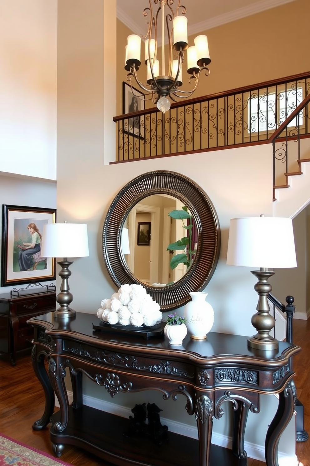 Elegant console table with decor accents. The console table is crafted from dark wood and features intricate carvings. On top of the table, a large round mirror with a decorative frame reflects the light. Flanking the table are two stylish table lamps with soft white shades, creating a warm ambiance. Two story foyer design ideas. The foyer boasts a grand staircase with a wrought iron railing and a stunning chandelier hanging from the ceiling. The walls are adorned with framed artwork, and a large potted plant adds a touch of greenery to the space.