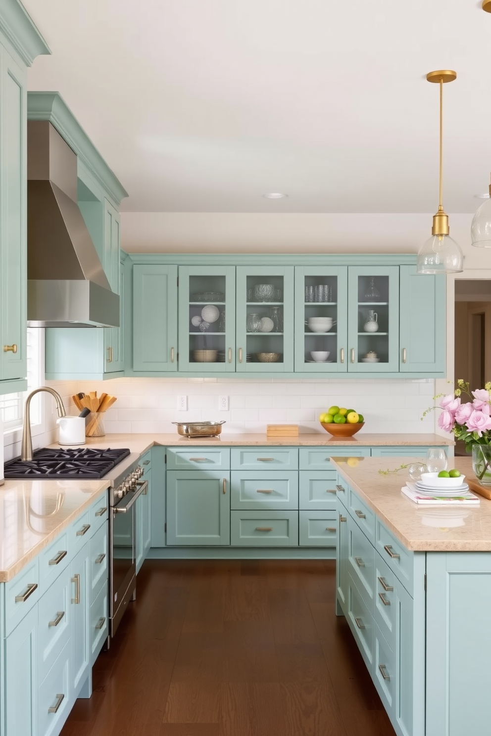 A contemporary kitchen featuring cool mint green cabinetry paired with warm beige countertops. The space is illuminated by pendant lights hanging above a spacious island, creating a welcoming atmosphere for cooking and entertaining.