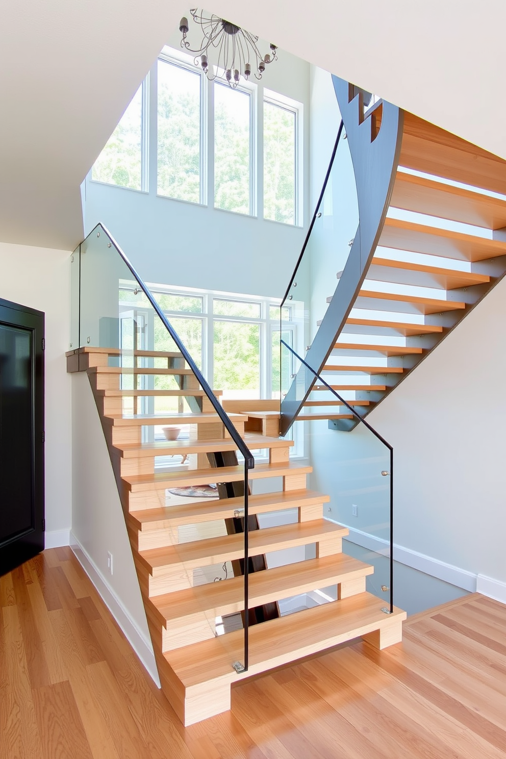 A U-shaped staircase with open risers creates an airy and spacious feel in the entryway. The stairs are finished in a light wood, complemented by a sleek glass railing that enhances the modern aesthetic.