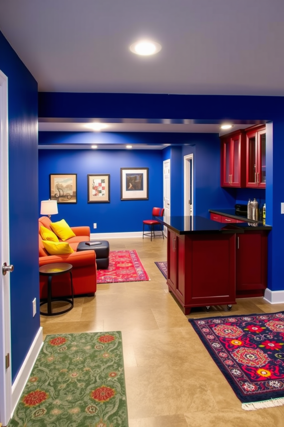 A vibrant unfinished basement transformed into a lively entertainment space. The walls are painted in bold cobalt blue, creating a striking backdrop for a cozy seating area with bright yellow accents. A custom bar area features deep red cabinetry and sleek black countertops, perfect for hosting gatherings. The floor is polished concrete, complemented by colorful area rugs that add warmth and character to the space.