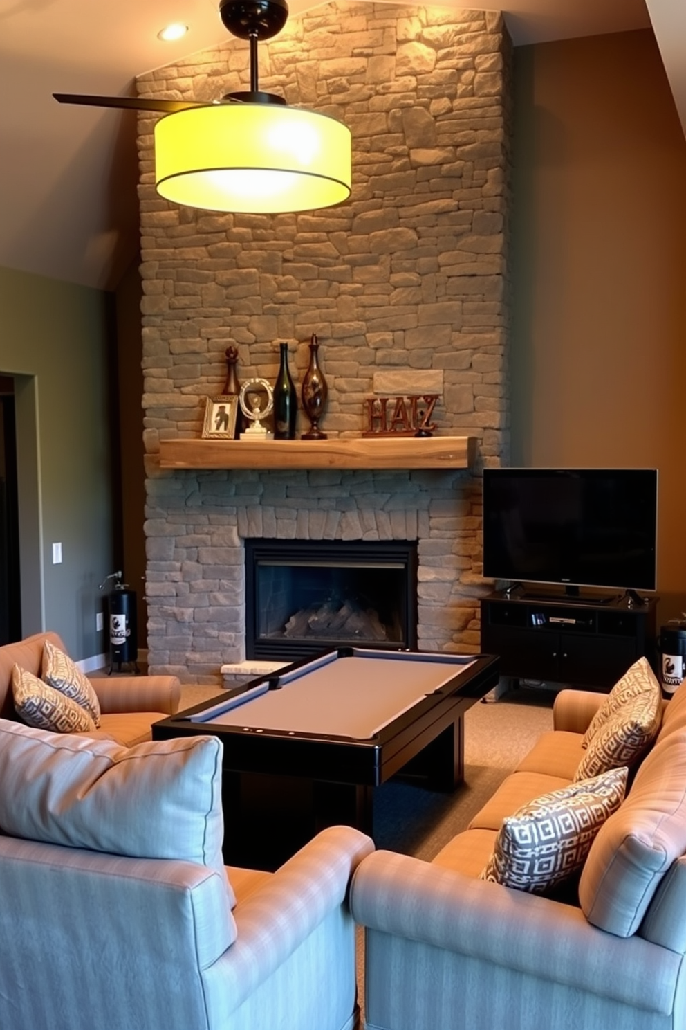 A cozy fireplace setting creates warmth and ambiance in the room. The fireplace is framed by a rustic stone wall with a wooden mantel adorned with decorative items. The unfinished basement features a man cave designed for relaxation and entertainment. Plush seating is arranged around a large flat-screen TV, while a pool table occupies the center of the space.