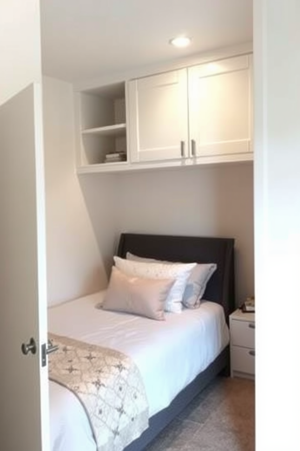 A very small bedroom featuring a pocket door that maximizes space efficiency. The room is decorated in soft neutral tones with a cozy bed pushed against one wall and built-in shelves above for storage.