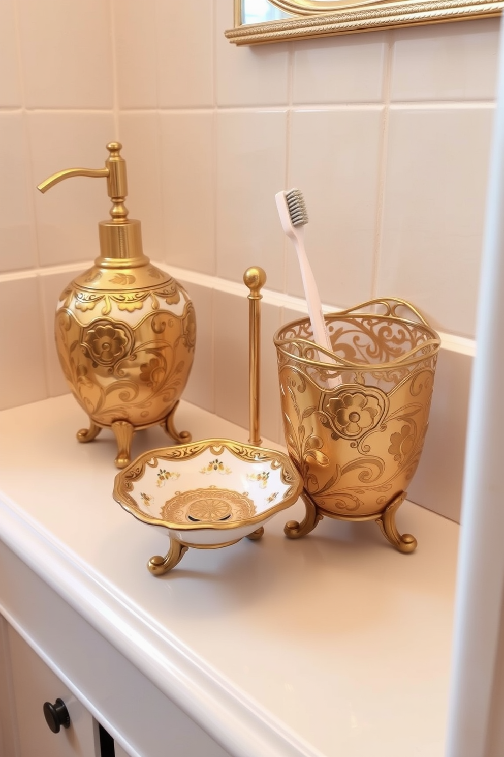 Elegant footed bathroom accessories set in a Victorian powder room. The accessories include a soap dish, toothbrush holder, and a small wastebasket all featuring intricate floral patterns and a polished gold finish.