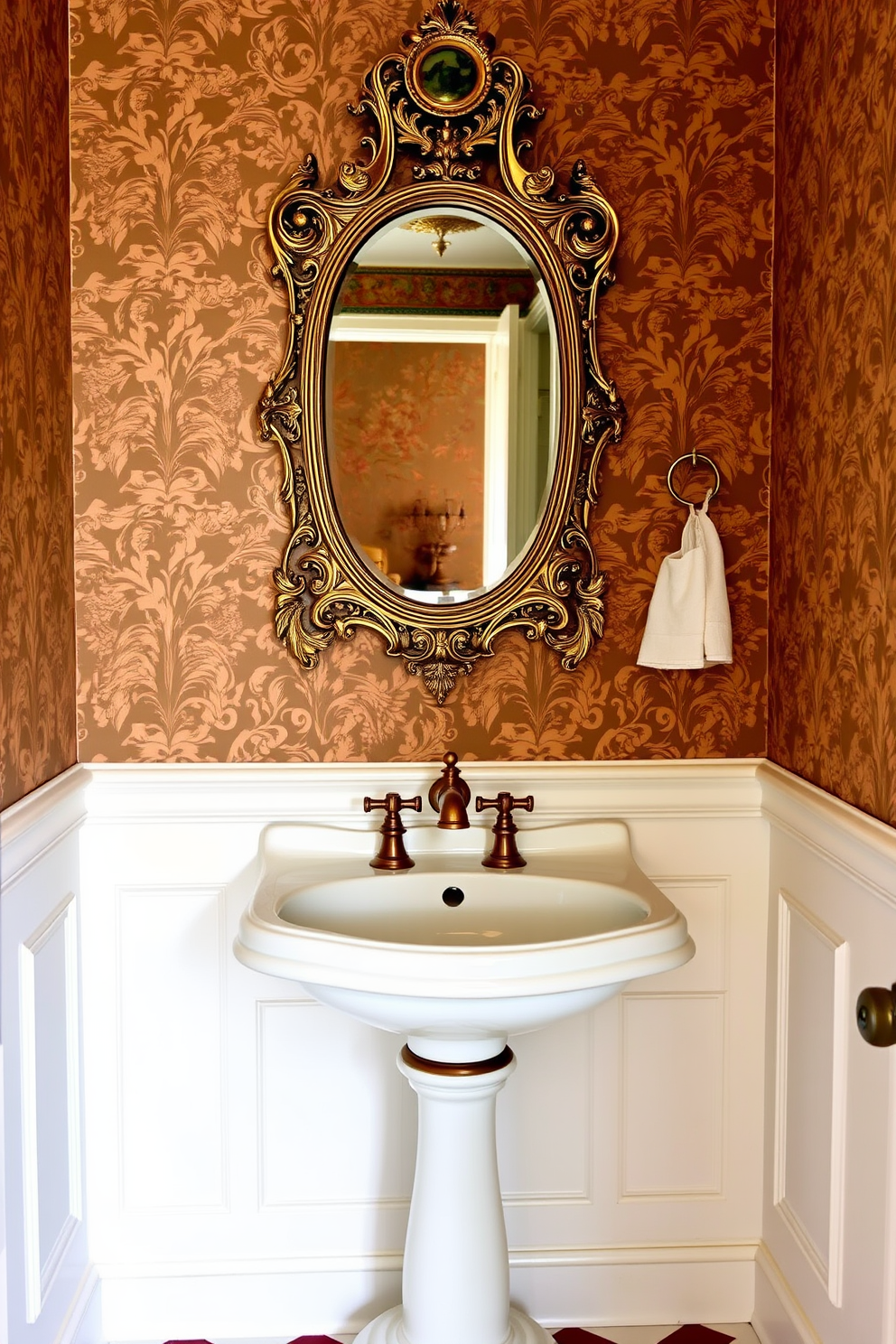 Antique pedestal sink with brass fixtures creates a focal point in the Victorian powder room. The walls are adorned with intricate wallpaper featuring floral patterns, and a vintage mirror with an ornate frame hangs above the sink.