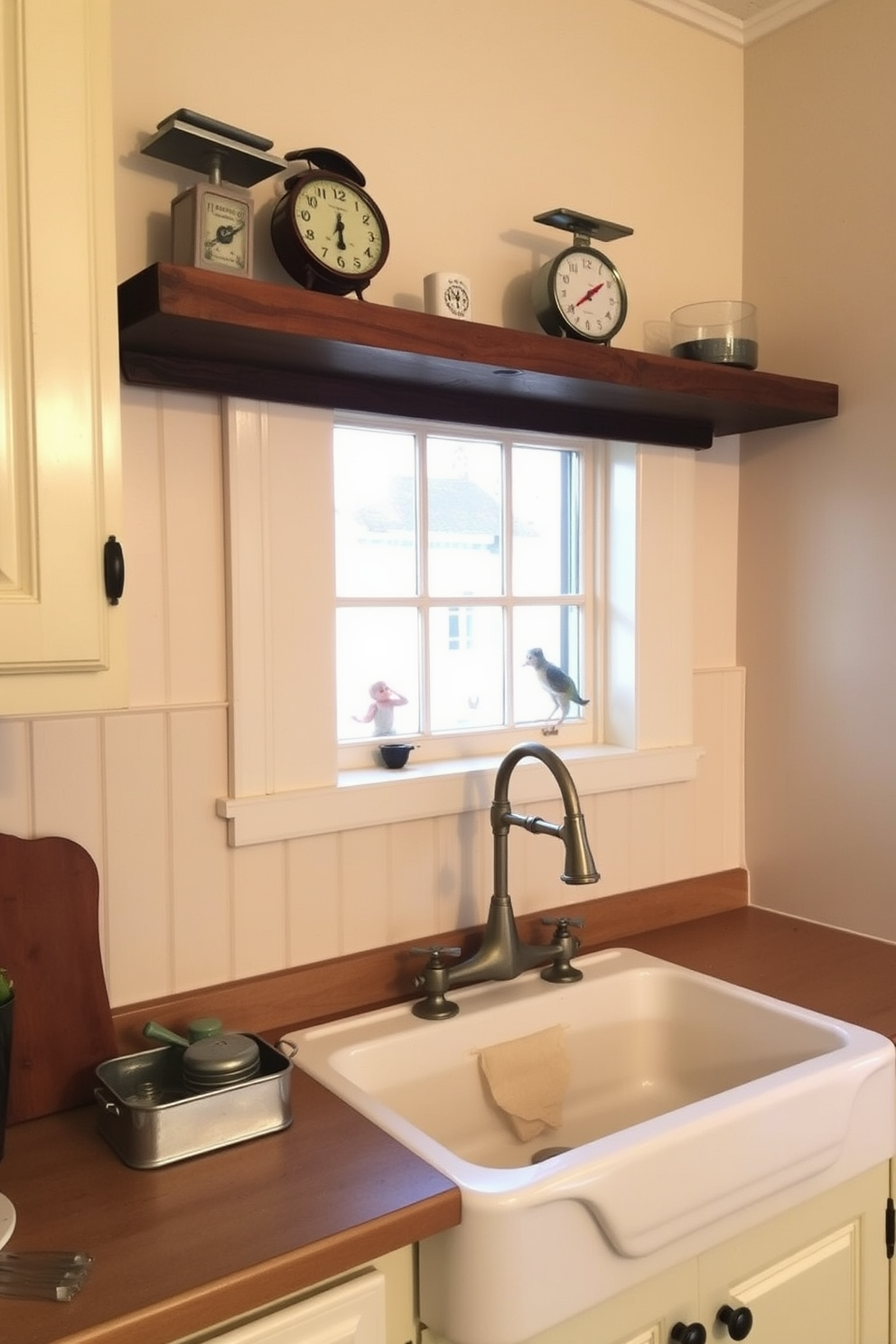 Classic white cabinets with glass doors create an elegant and timeless kitchen atmosphere. The cabinets are complemented by a rustic wooden countertop and vintage-style brass hardware, enhancing the overall charm of the space. A farmhouse sink sits beneath a window, allowing natural light to illuminate the room. Open shelving displays carefully curated dishware, adding a personal touch to the vintage kitchen design.