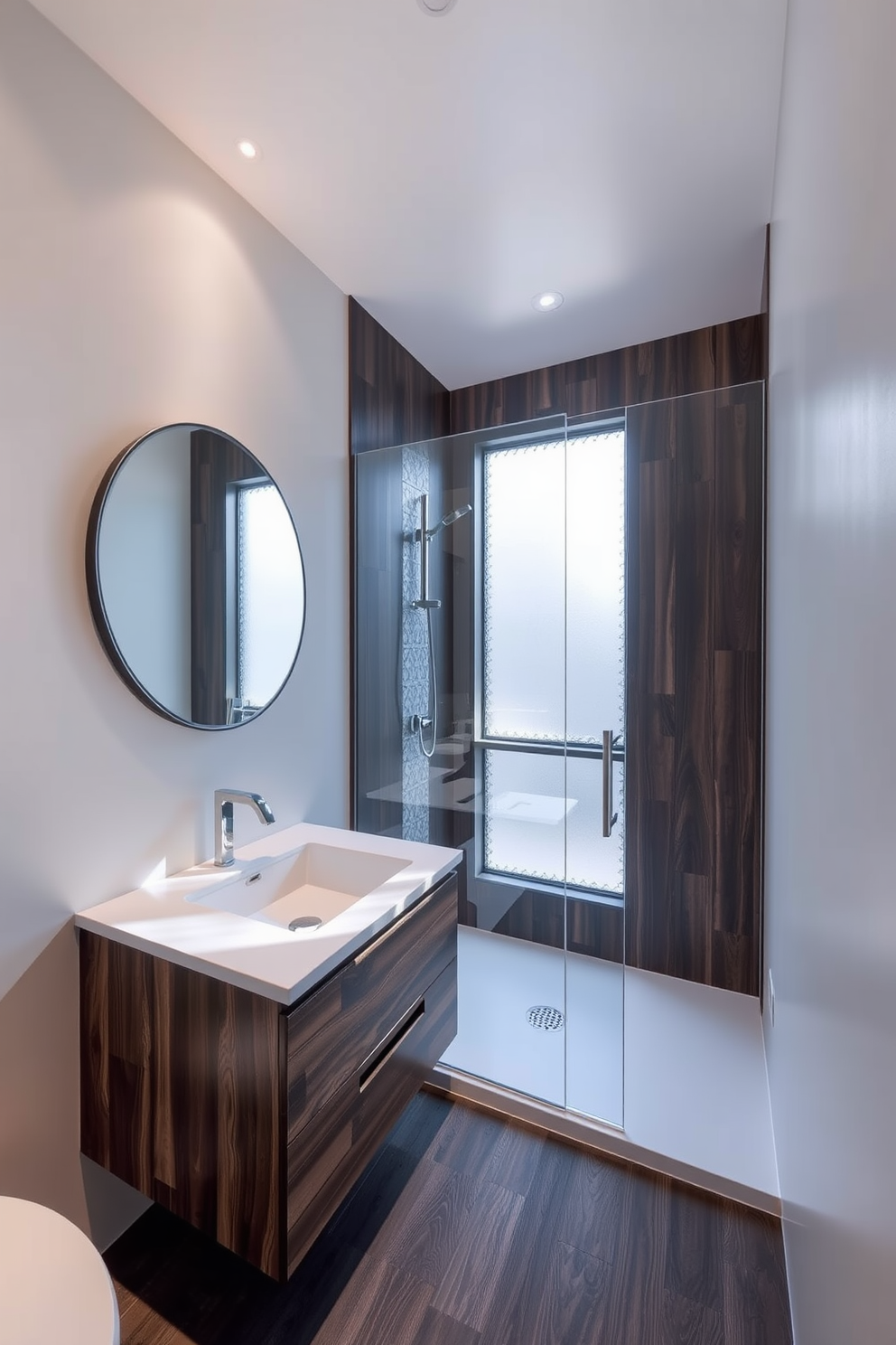 A modern bathroom featuring a floating vanity made of dark wood with a sleek white countertop. Above the vanity, a large round mirror with a minimalist design reflects the soft ambient lighting. The walk-in shower is enclosed with clear glass panels and accented with decorative tiles in a geometric pattern. Natural light streams in through a frosted window, creating a serene and inviting atmosphere.