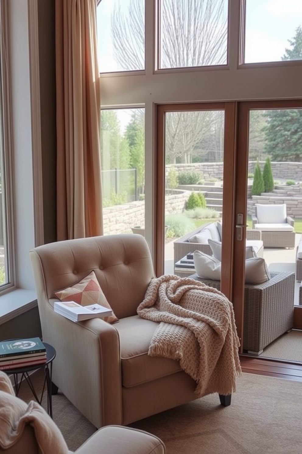 Cozy reading nook with natural light. A plush armchair is positioned near a large window, allowing sunlight to stream in and illuminate the space. A small side table holds a stack of books and a steaming cup of tea. Soft, textured throw blankets are draped over the armchair, creating an inviting atmosphere. Walkout Basement Design Ideas. The basement features large sliding glass doors that open to a beautifully landscaped backyard, bringing in ample natural light. Comfortable seating arrangements with a mix of modern and rustic elements create a welcoming space for relaxation and entertainment.