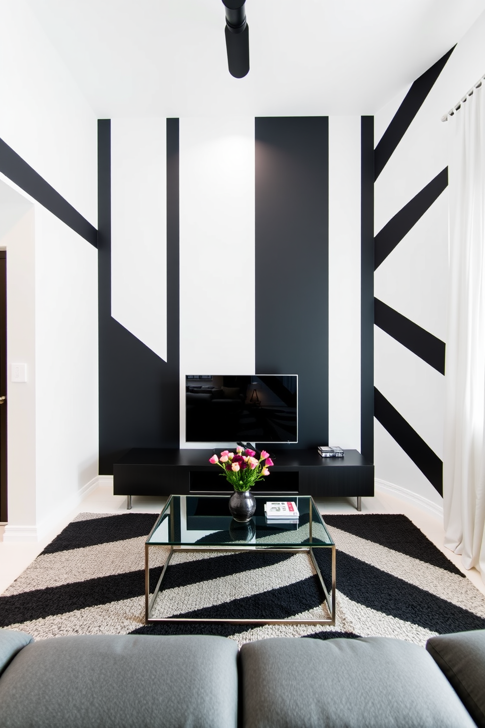 A minimalist living room featuring a striking black and white contrast wall. The walls are painted with bold geometric patterns in black and white, creating a modern and sophisticated atmosphere.