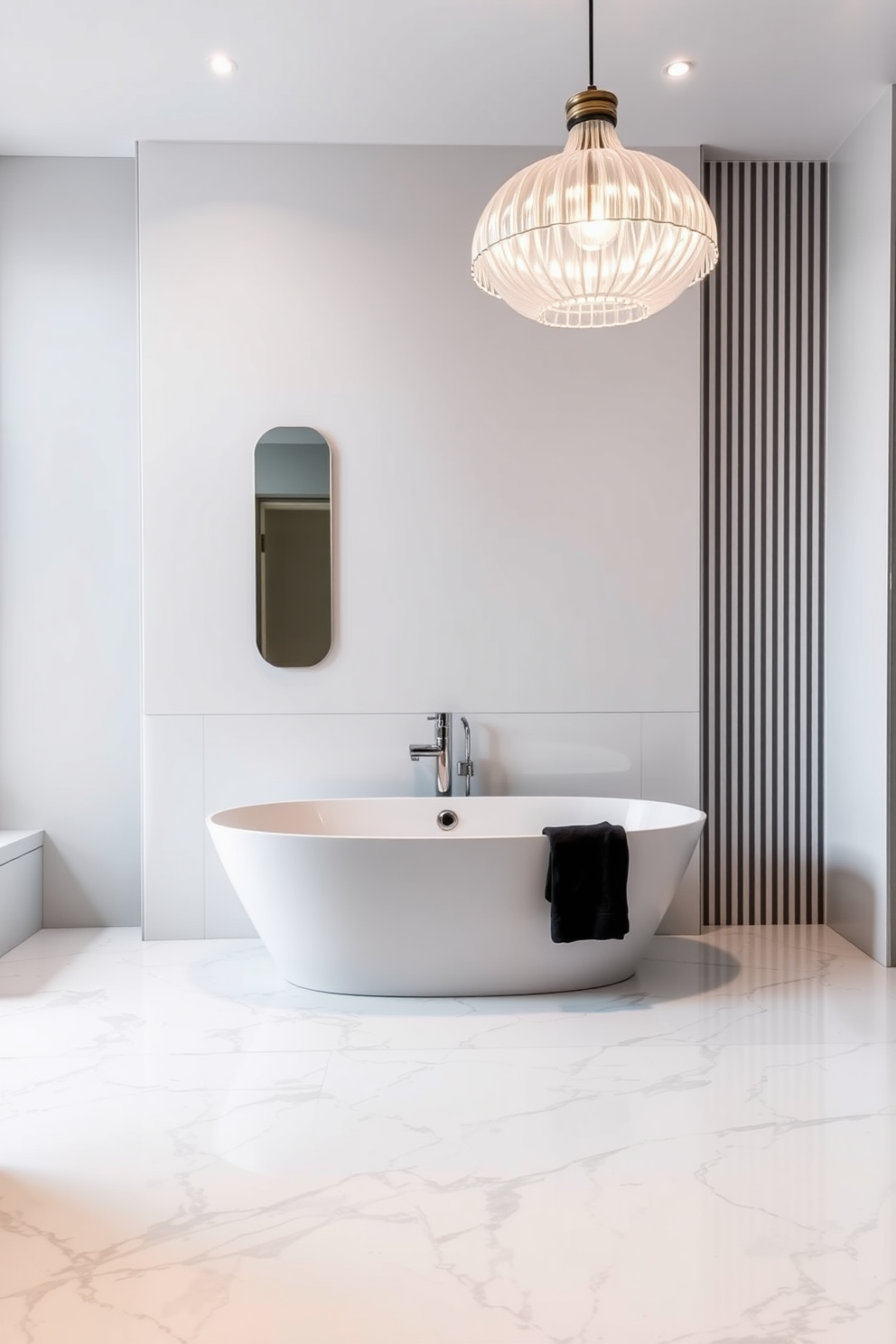 A stylish bathroom featuring a freestanding tub positioned under a beautiful pendant light. The walls are adorned with sleek white tiles and the floor showcases elegant marble, creating a serene and modern atmosphere.