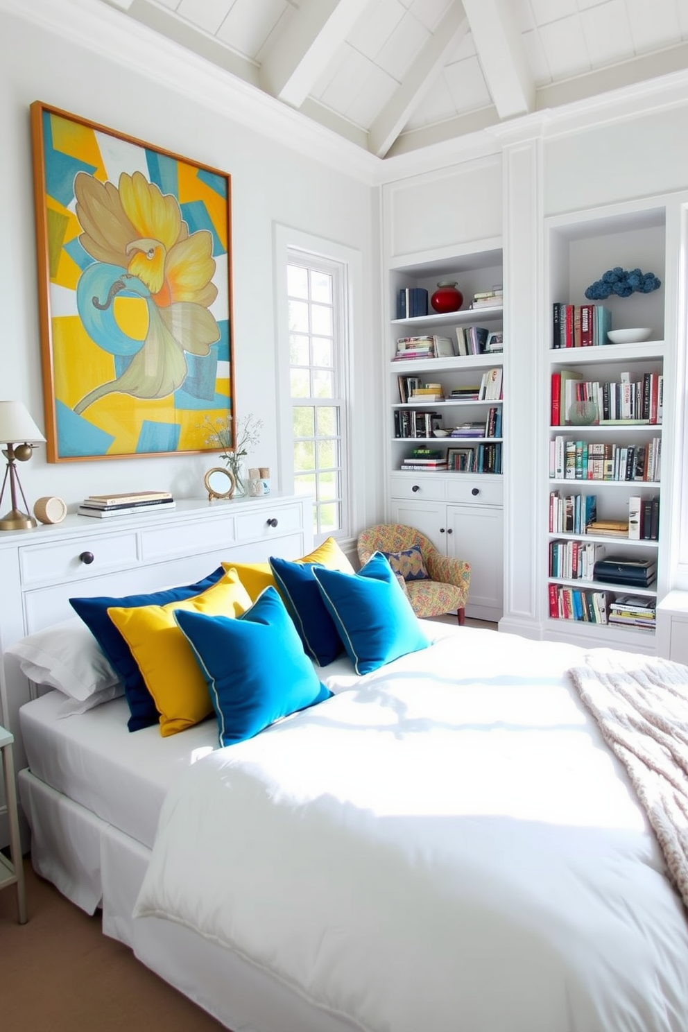 A serene white bedroom featuring a plush white bed adorned with colorful throw pillows in shades of blue and yellow. A stylish white dresser sits against the wall, complemented by vibrant artwork that adds a lively touch to the space. Natural light floods the room through large windows, highlighting the airy atmosphere. A cozy reading nook with a colorful accent chair is positioned beside a tall bookshelf filled with books and decorative items.