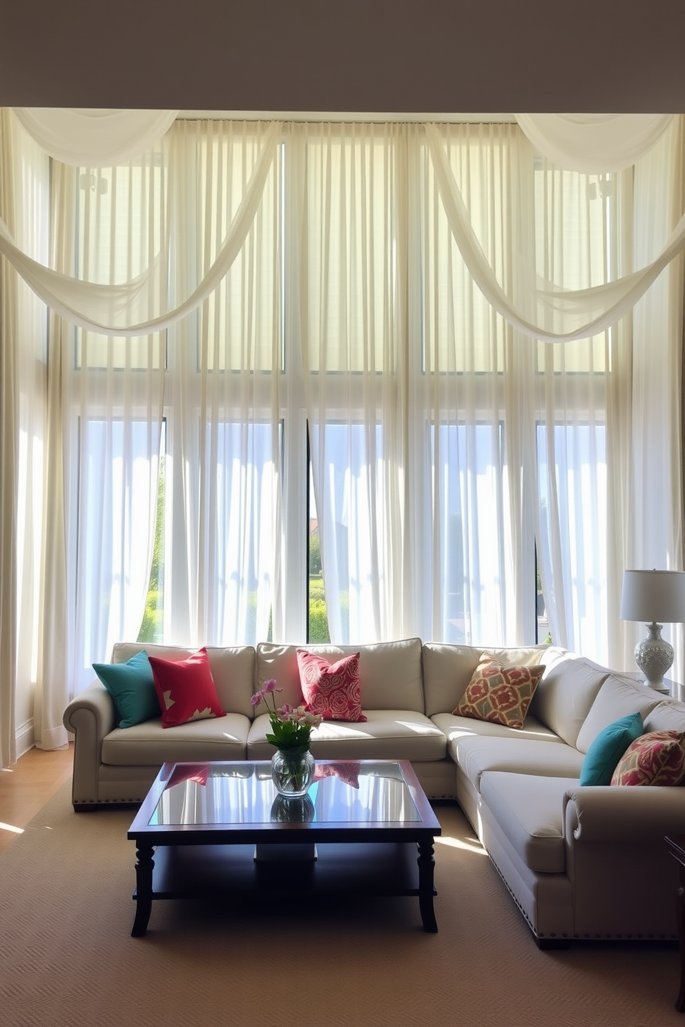 A bright and airy family room features large windows adorned with flowing white curtains that softly diffuse natural light. The space is designed with a comfortable sectional sofa in neutral tones, accented by colorful throw pillows that add a pop of vibrancy.