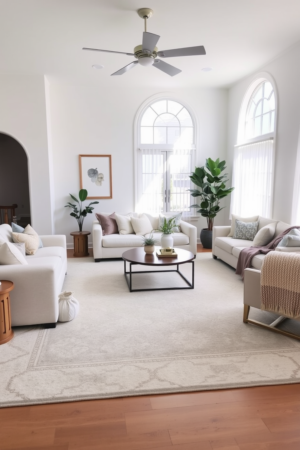 A bright and airy family room features a large area rug that anchors the seating arrangement, creating a cozy and inviting atmosphere. The rug is adorned with subtle geometric patterns in soft neutral tones, complementing the light-colored furniture and enhancing the overall aesthetic of the space. The walls are painted in a soft white hue, allowing natural light to flood the room and making it feel more spacious. A mix of plush cushions and throws in varying textures adds warmth and comfort, while strategically placed plants bring a touch of nature indoors.