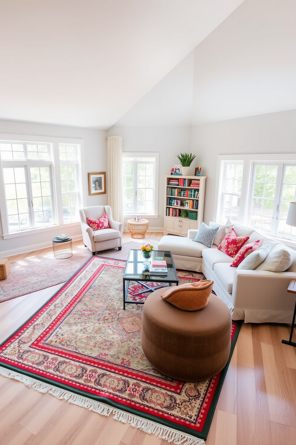 A bright and airy family room featuring layered rugs that add warmth and comfort to the space. The room is adorned with a large sectional sofa in soft white fabric, complemented by colorful throw pillows and a stylish coffee table at the center. Natural light floods in through large windows, illuminating the light wood flooring. A cozy reading nook is created in one corner with a plush armchair and a small bookshelf filled with family favorites.