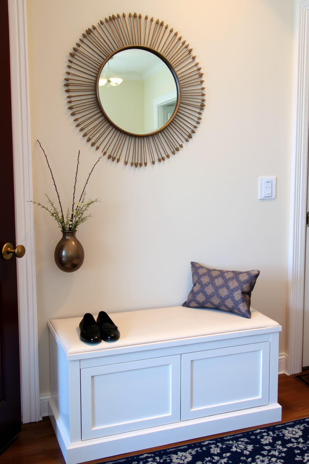 A bright and airy foyer features a sleek console table against the wall, adorned with a decorative mirror above it. Below the table, decorative baskets in natural woven materials provide organized storage for shoes and accessories, adding both function and style to the space. The walls are painted in a soft white hue, creating a clean and welcoming atmosphere. A stylish area rug in neutral tones lies beneath the console, enhancing the overall elegance of the foyer design.