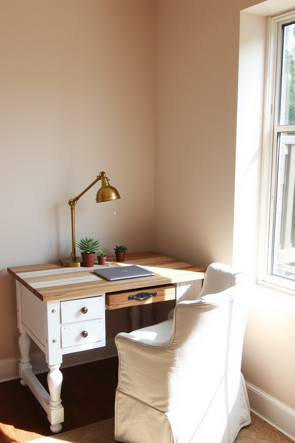 A rustic white desk with reclaimed wood accents sits against a backdrop of soft beige walls. The desk is adorned with a vintage brass lamp and a few potted succulents, creating a warm and inviting workspace. In the corner, a comfortable armchair upholstered in neutral fabric complements the desk's rustic charm. Natural light streams in through a large window, illuminating the space and enhancing the cozy atmosphere.