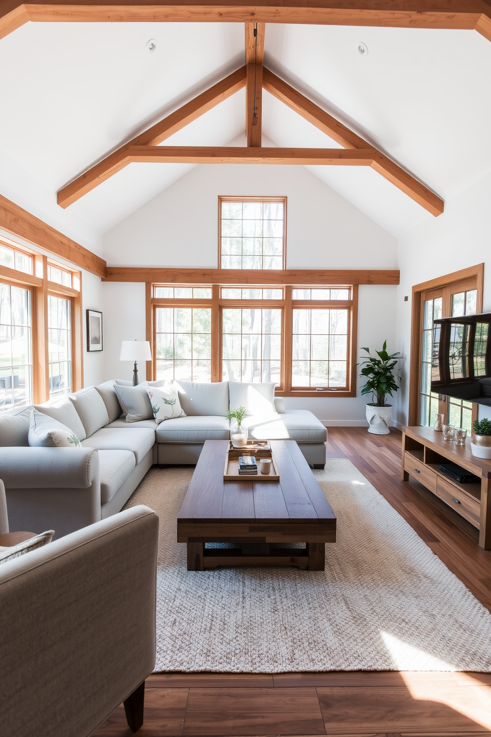 Bright white walls with wooden beams create an inviting and airy atmosphere in the living room. The space features a plush sectional sofa in soft gray, complemented by a large coffee table made of reclaimed wood. Natural light floods through expansive windows, enhancing the warmth of the wooden accents. A cozy area rug in neutral tones anchors the seating area, while decorative pillows add pops of color and texture.