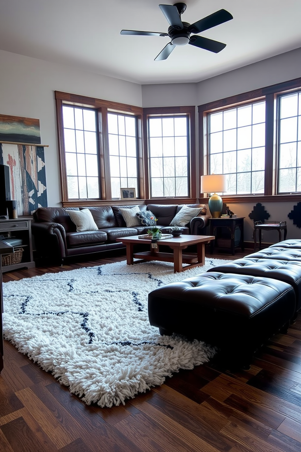 A stylish white area rug lays across the floor, adding warmth and texture to the space. The rug complements the surrounding furniture, creating a cozy atmosphere in the room. The man cave features a blend of modern and rustic elements, with a leather sofa and reclaimed wood accents. Large windows allow natural light to flood in, enhancing the inviting ambiance of the space.