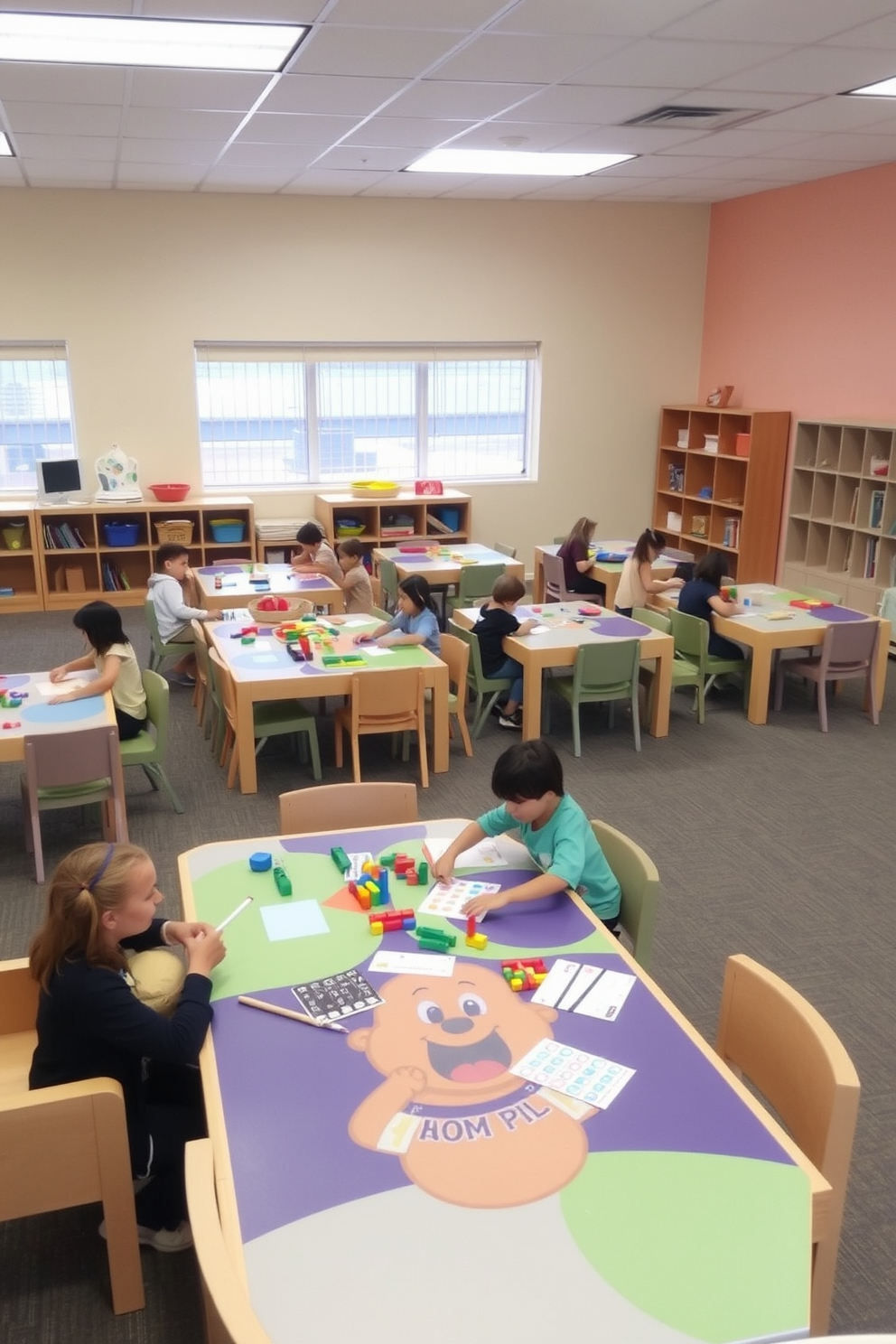 A spacious playroom filled with interactive play tables designed for hands-on fun. The walls are painted in soft pastel colors, creating a cheerful and inviting atmosphere. Each table features various engaging activities such as building blocks, art supplies, and educational games. Comfortable seating is arranged around the tables, encouraging collaboration and creativity among children.