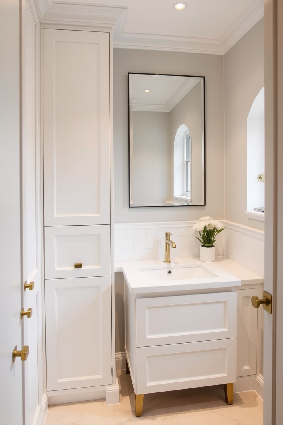 Custom cabinetry for tailored storage. The cabinetry features sleek lines and a crisp white finish, seamlessly integrating with the elegant powder room design. The space is accentuated with gold hardware and soft ambient lighting. A minimalist mirror above the sink reflects the sophisticated aesthetic of the room.