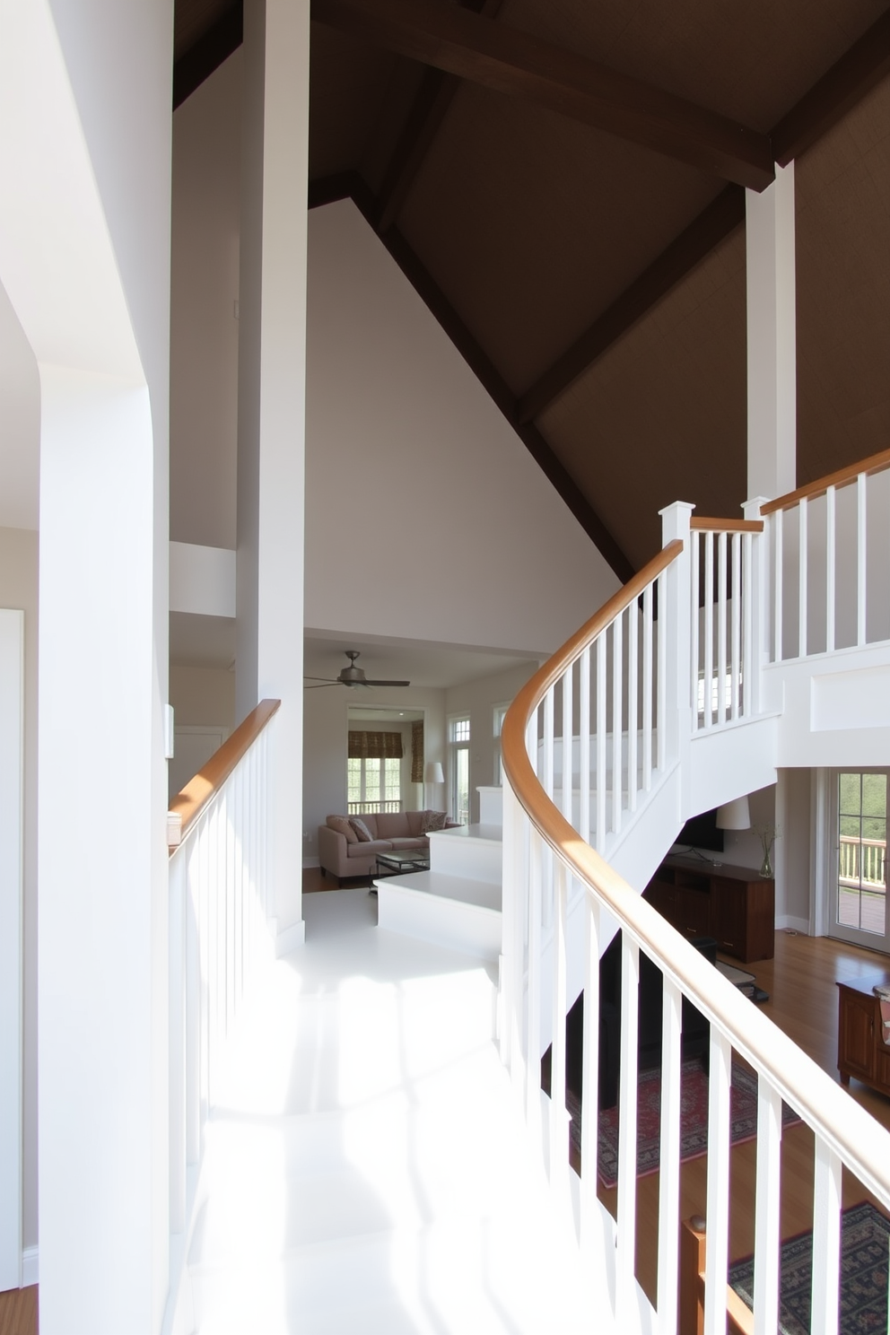 An elegant open concept white staircase gracefully ascends, providing a stunning view of the spacious living area below. The staircase features sleek white railings and a polished wooden handrail that complements the airy atmosphere of the home.