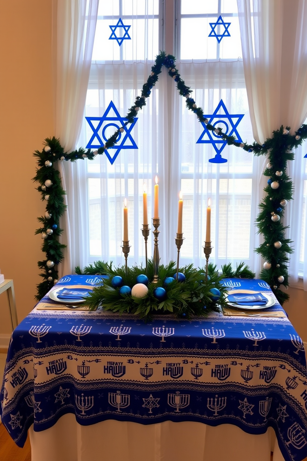 A festive Hanukkah table is set with a beautiful blue and white tablecloth featuring traditional menorah and dreidel patterns. The table is adorned with elegant silver candlesticks holding lit candles, and a centerpiece of fresh greenery and blue ornaments adds a touch of holiday spirit. The windows are decorated with sheer white curtains that allow natural light to filter through, complemented by blue and silver garlands draped along the sills. Festive window decals of stars and menorahs create a cheerful atmosphere, inviting warmth and celebration into the home.