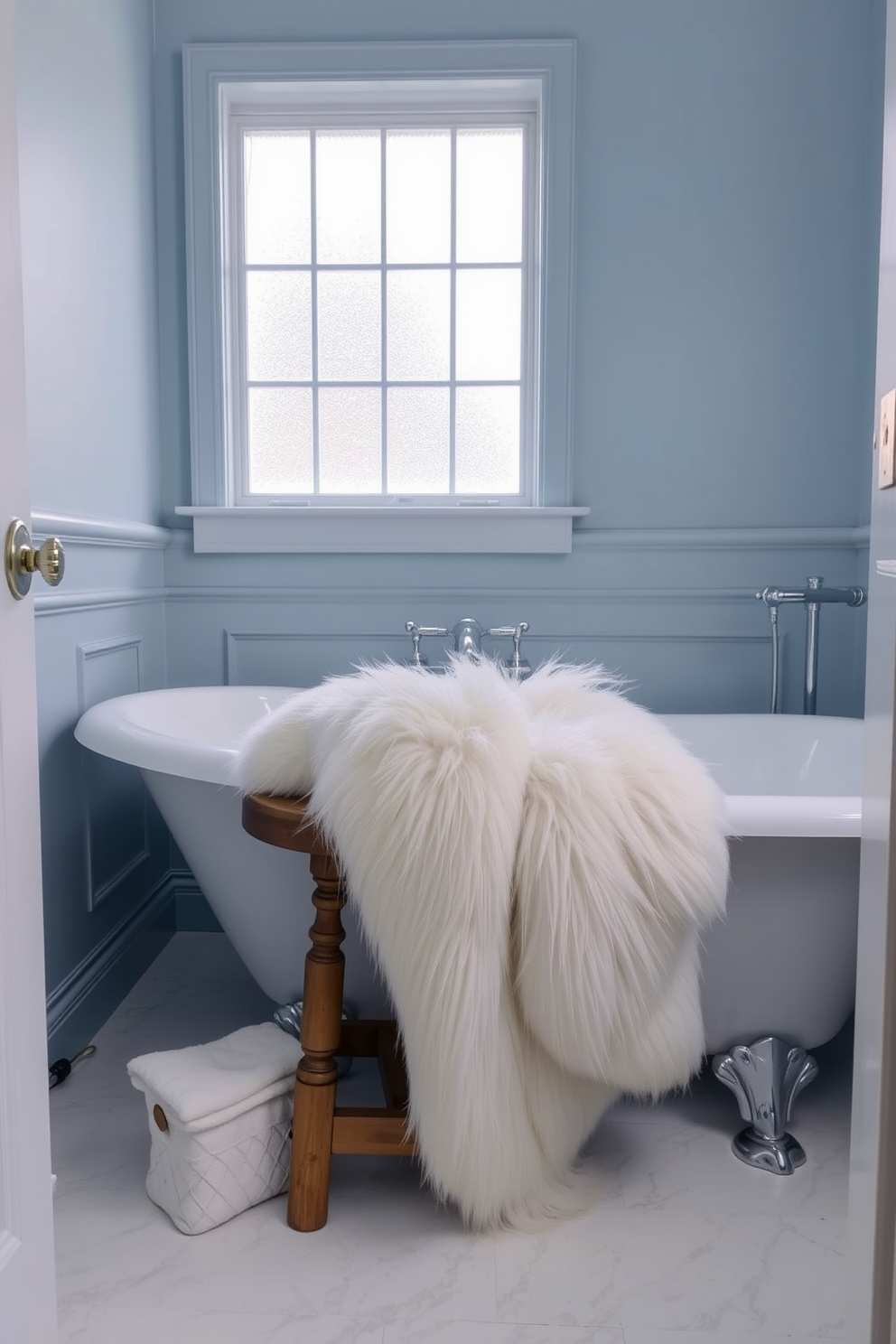 A serene winter bathroom setting featuring elegant gold accents. The space includes a freestanding bathtub adorned with gold fixtures, surrounded by frosted glass windows that let in soft natural light. The walls are painted in a soft white, complemented by plush grey towels and a cozy rug. A decorative arrangement of pine branches and white candles adds a seasonal touch, enhancing the overall elegance of the space.