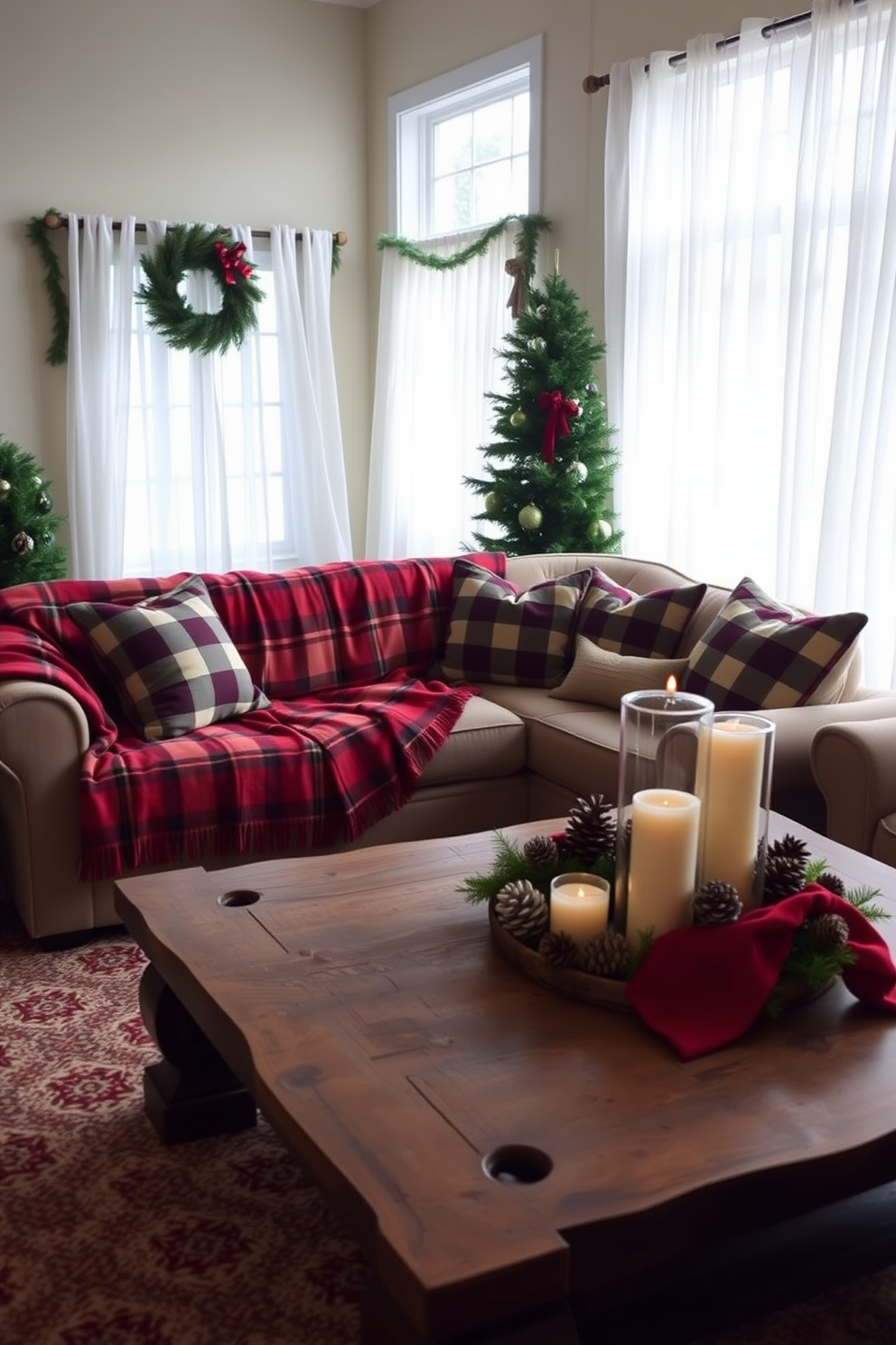 A cozy living room adorned with winter decorations. The sofa is draped with a plaid throw blanket in shades of red and green, complemented by matching plaid cushions. A rustic coffee table features a centerpiece of pinecones and candles. The windows are dressed with sheer white curtains, allowing soft natural light to illuminate the space.