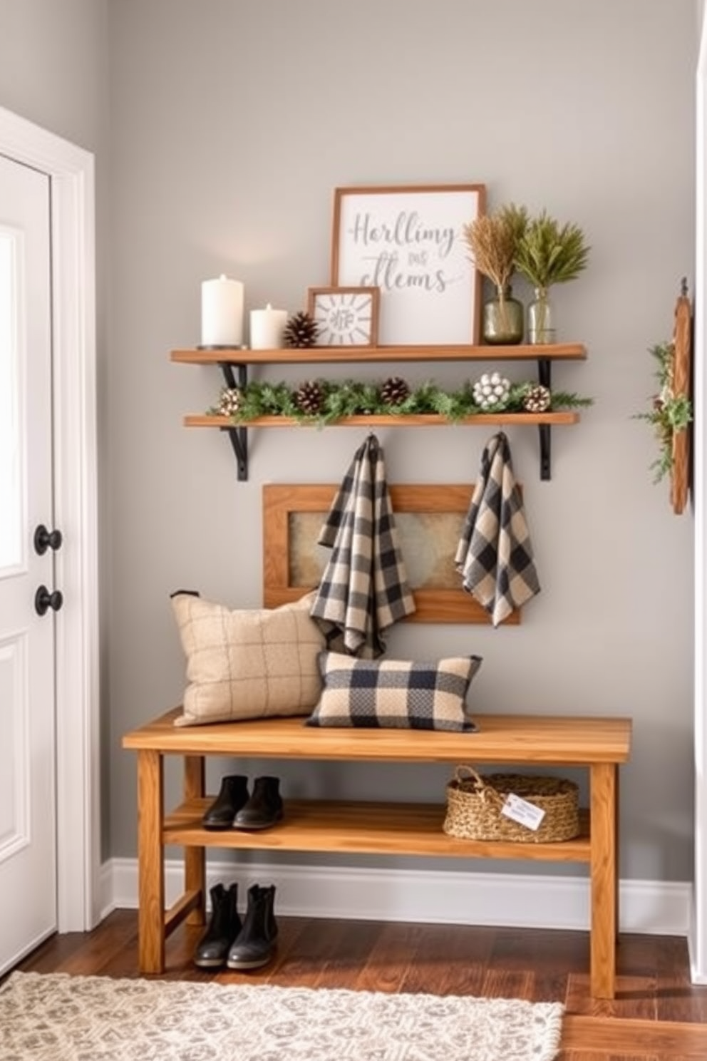 A cozy winter entryway features wall-mounted shelves adorned with decorative items such as candles, pinecones, and holiday-themed accents. The walls are painted a soft gray, while a warm wooden bench sits below the shelves, inviting guests to sit and remove their shoes.