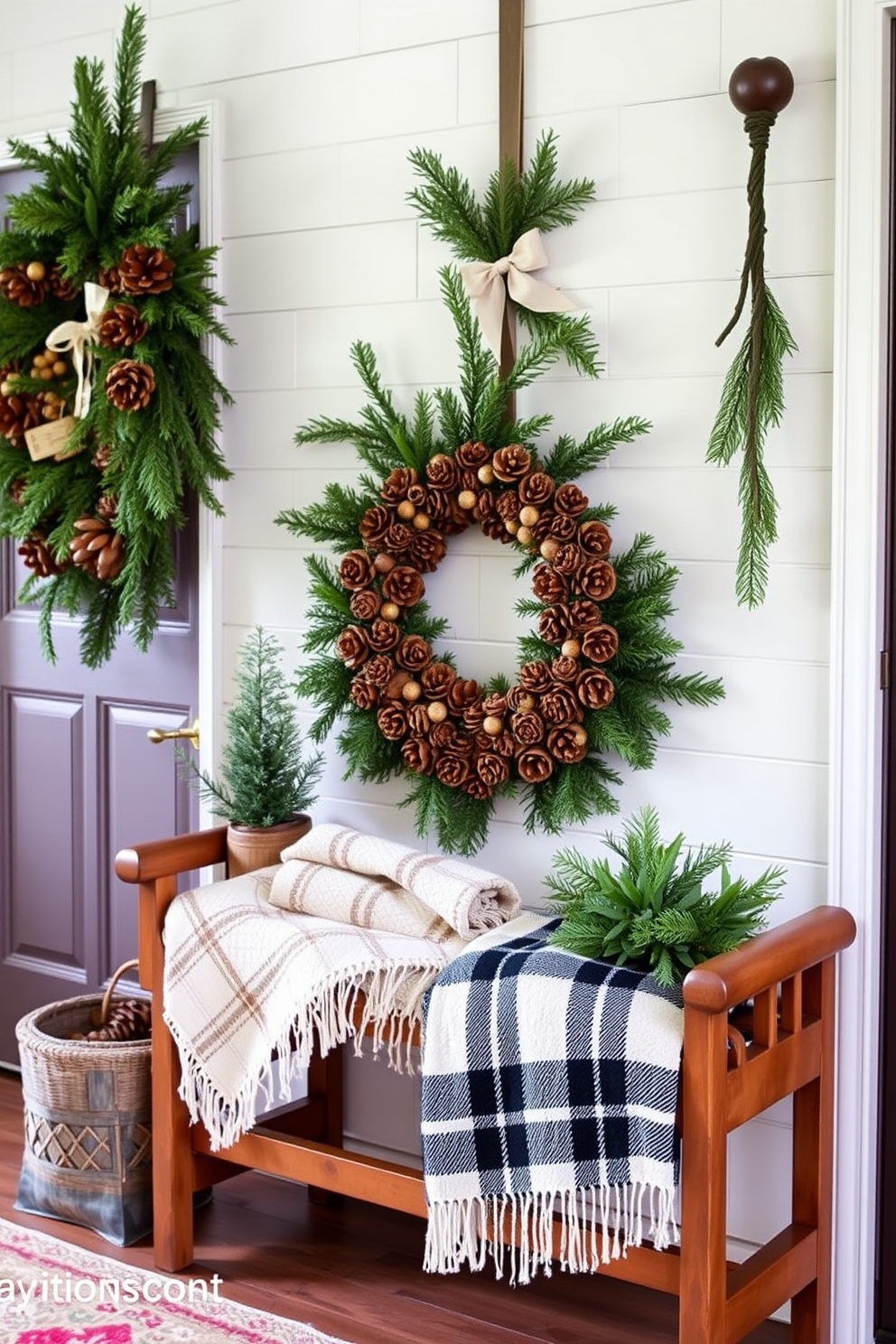 A cozy winter entryway adorned with pinecone and evergreen arrangements. The space features a wooden bench with a soft plaid throw blanket draped over it, complemented by a rustic wreath made of pinecones and fresh greenery hanging on the door.