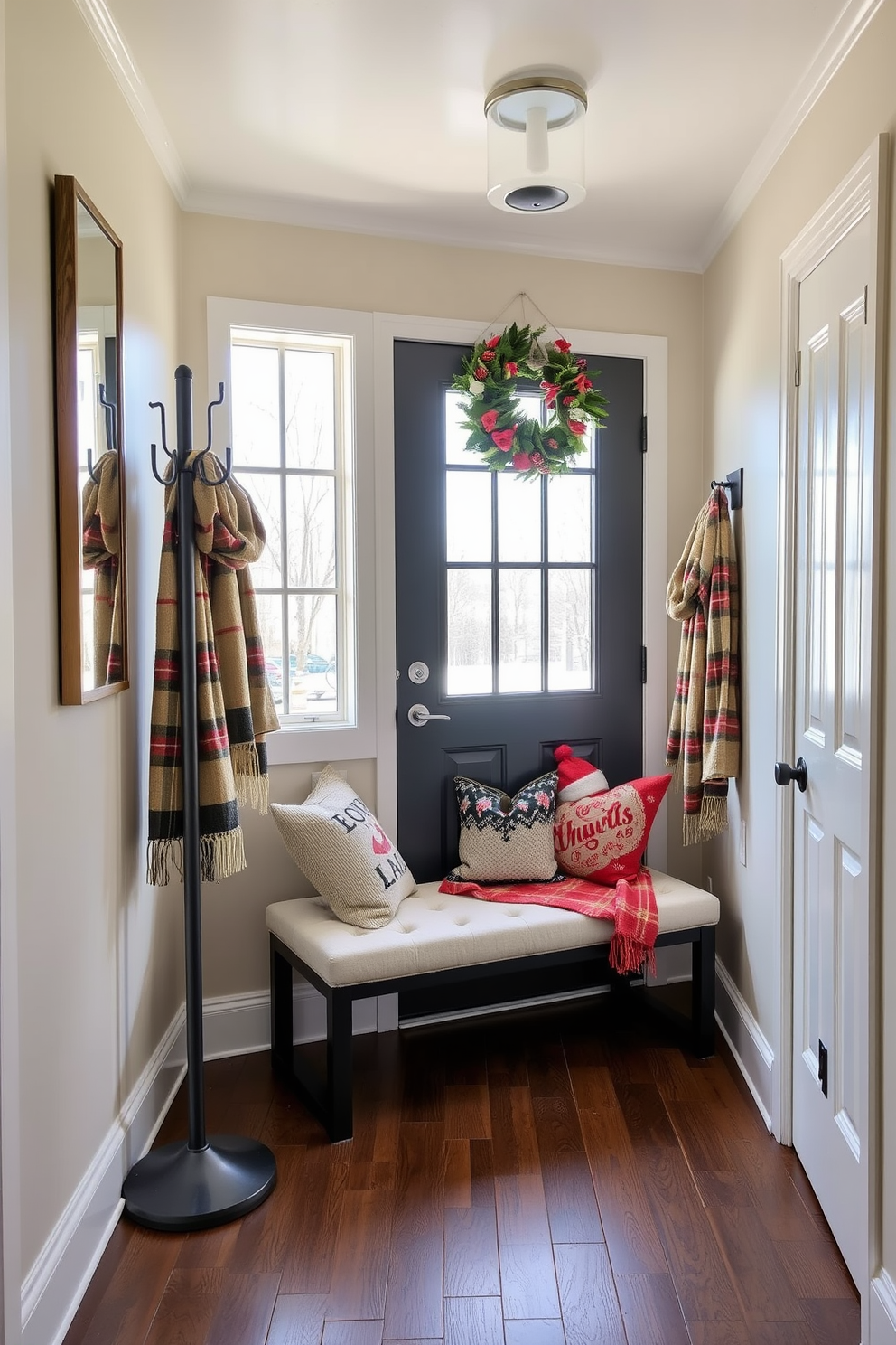 A winter entryway filled with natural light. The space features mirrored accents on the walls and furniture to enhance brightness and create a welcoming atmosphere. A cozy bench with plush cushions sits against the wall, surrounded by decorative winter-themed pillows. A stylish coat rack stands nearby, adorned with seasonal scarves and hats, while a festive wreath hangs on the door.