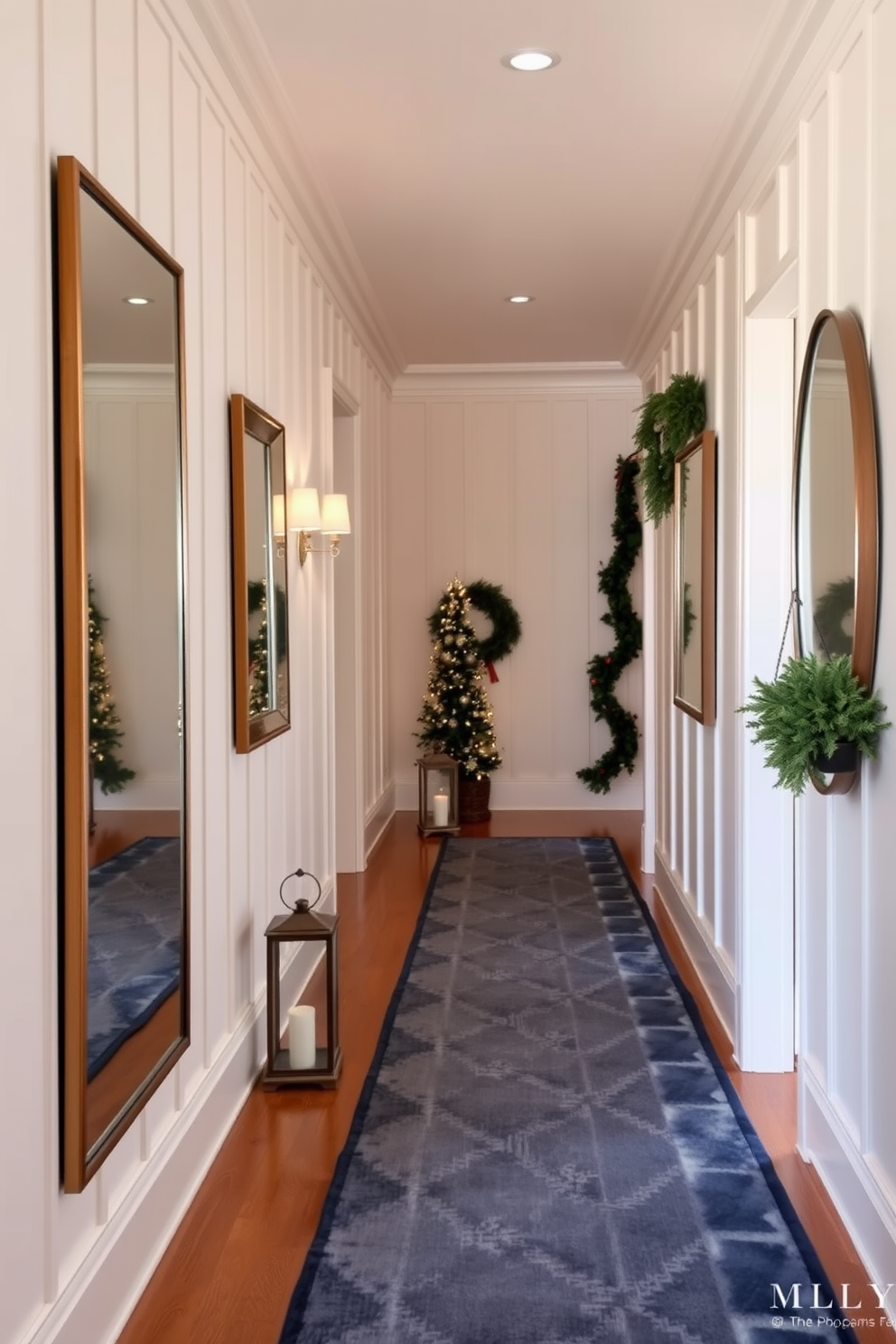 A winter hallway featuring a cozy and inviting atmosphere. The walls are adorned with soft white paneling, and a runner rug in shades of deep blue and silver lines the floor. On one side, a series of mirrors in varying sizes are arranged to reflect light and create an illusion of depth. Seasonal decor such as pine garlands and lanterns adds warmth and charm to the space.