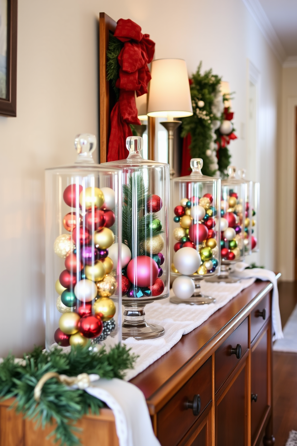 A cozy winter hallway is adorned with clear glass containers filled with various ornaments in festive colors. The containers are strategically placed on a wooden console table, enhancing the seasonal charm of the space.