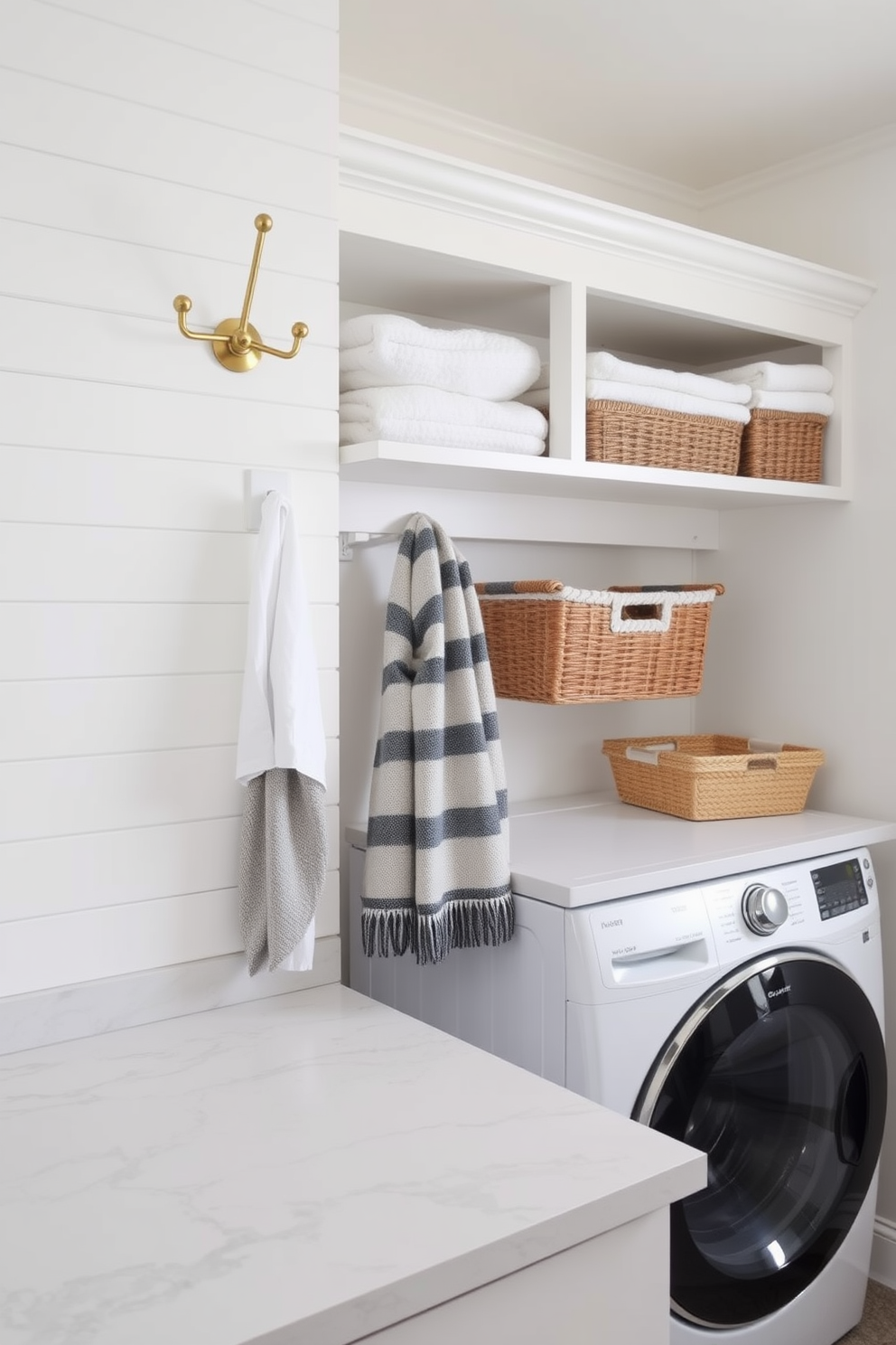 Stylish hooks for winter accessories. The hooks are made of brushed brass and are mounted on a shiplap wall painted in a soft white color. Winter Laundry Room Decorating Ideas. The laundry room features a sleek countertop made of quartz, with open shelving above displaying neatly folded towels and baskets for organization.