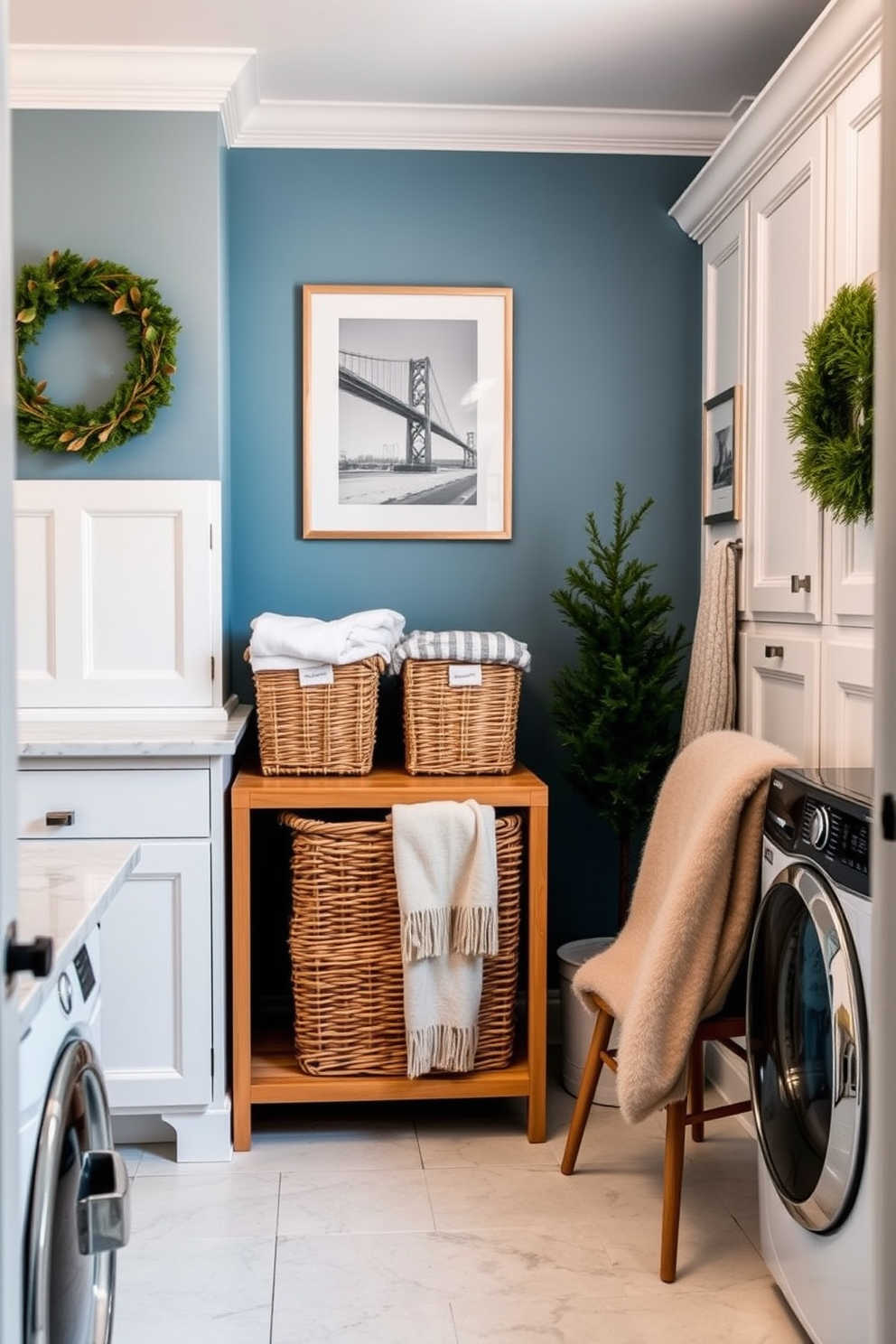 A stylish laundry room features elegant laundry baskets made from natural wicker, arranged neatly on a wooden shelf. The walls are painted in a soft blue hue, complemented by white cabinetry and a marble countertop for a fresh and inviting atmosphere. Winter decorations include cozy accents such as a fluffy throw blanket draped over a chair and seasonal artwork on the walls. A small potted evergreen adds a touch of greenery, while warm lighting creates a welcoming ambiance in the space.