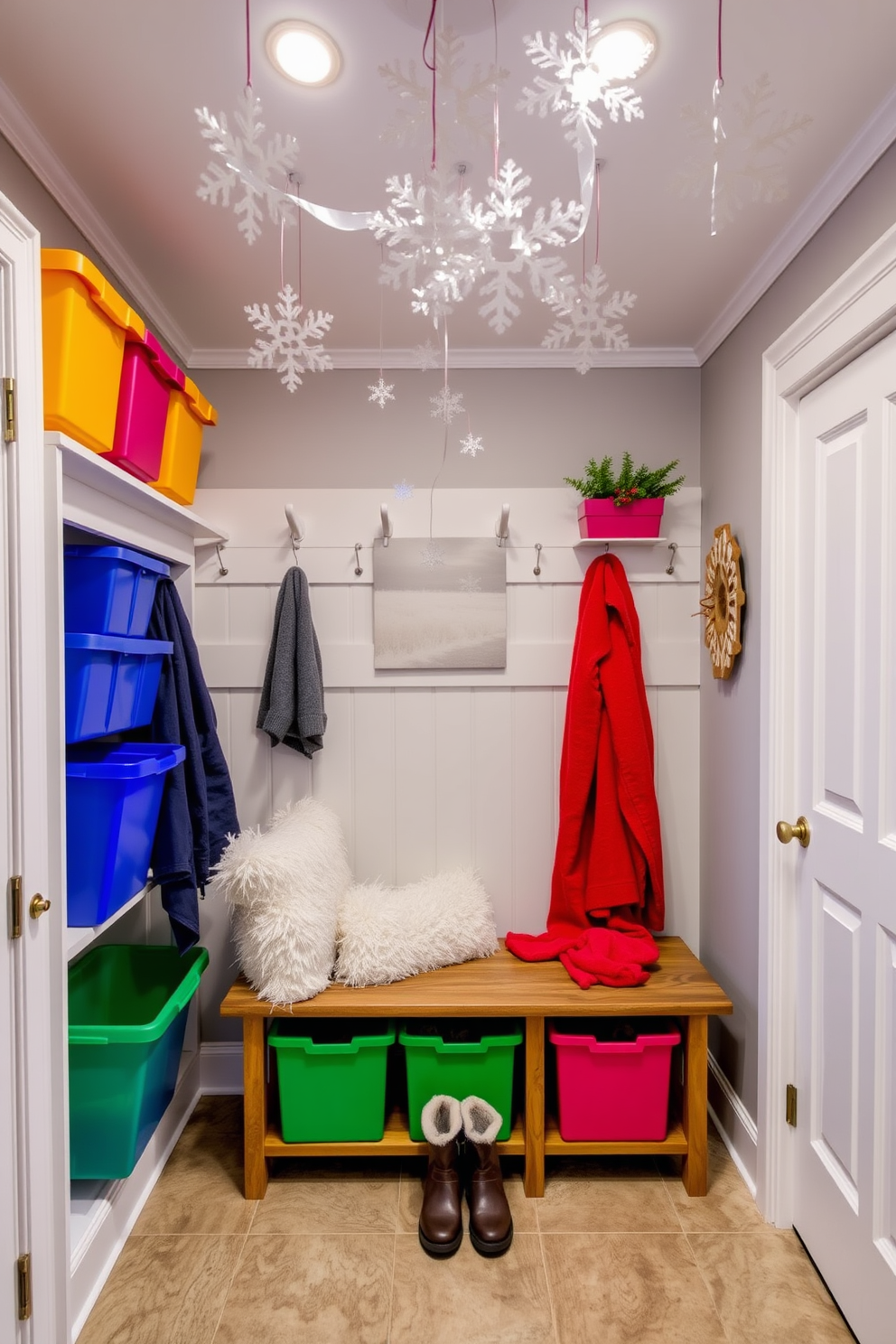 A whimsical winter mudroom features playful snowflake decorations hanging from the ceiling. Brightly colored bins are organized along the walls, and a cozy bench with fluffy cushions invites guests to take off their snowy boots.