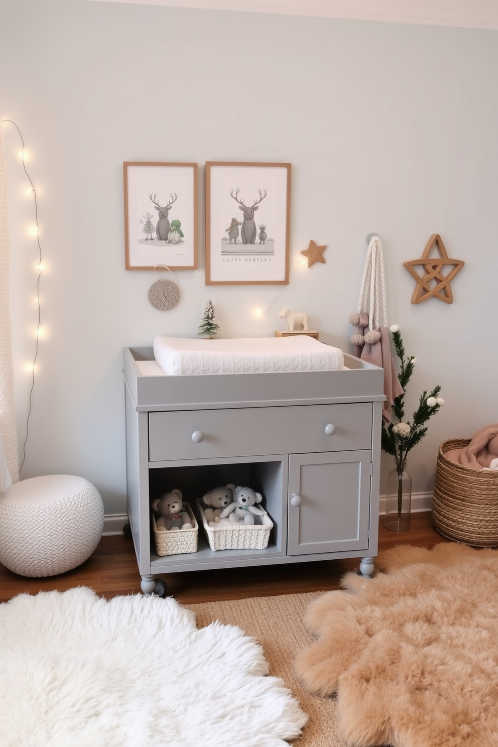 A stylish changing table with ample storage is the focal point of the winter nursery. The table features a soft, neutral-toned cushion on top and is surrounded by cozy winter-themed decor. The walls are painted in a calming pale blue, creating a serene atmosphere. Soft, plush rugs in warm tones cover the floor, and delicate fairy lights add a touch of warmth to the space.