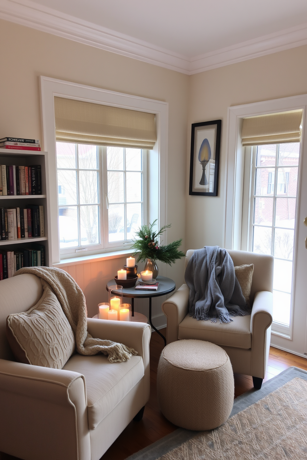 A cozy winter reading nook with plush armchairs and a soft throw blanket draped over one. A small side table holds an assortment of seasonal scented candles, creating a warm and inviting atmosphere. The walls are painted in a soft cream color, and a large window allows natural light to flood the space. A bookshelf filled with favorite novels lines one side, while a small rug adds a touch of comfort underfoot.