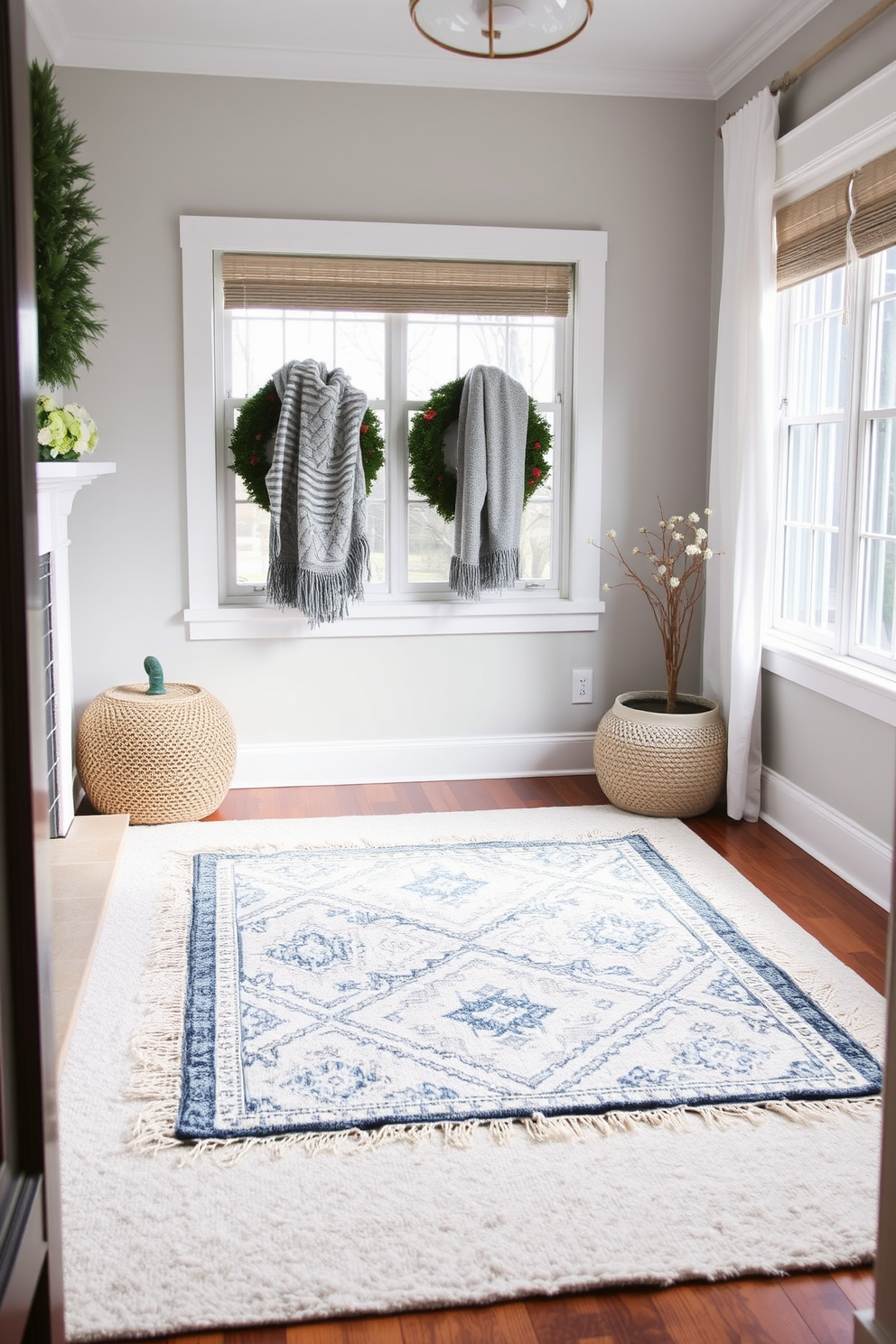 A cozy winter small space features layered rugs that add warmth and texture to the room. The base rug is a soft neutral shade, while a smaller patterned rug sits on top, creating visual interest and comfort underfoot.