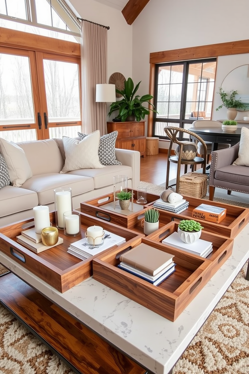 A collection of wooden trays arranged on a stylish coffee table in a modern living room. The trays are filled with decorative items such as candles, books, and small plants, creating an organized yet inviting atmosphere. The living room features a cozy seating area with a plush sofa and accent chairs, complemented by warm wooden elements. Large windows allow natural light to flood the space, highlighting the rich textures and earthy tones of the decor.