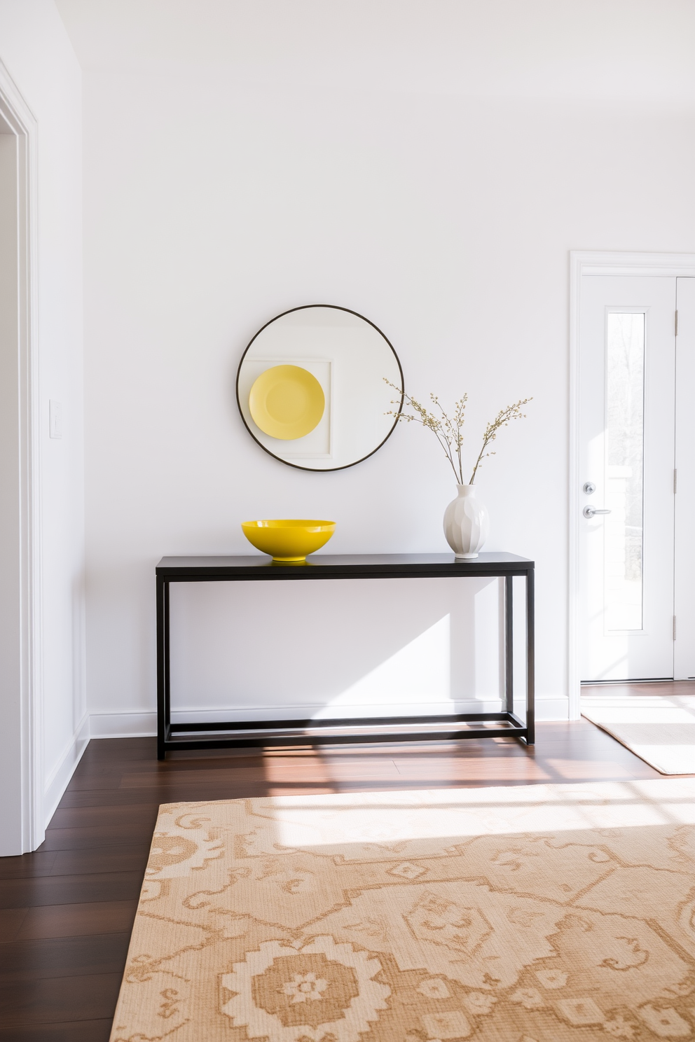 A bright and inviting foyer features a sleek console table against the wall. On the table, yellow decorative bowls are artfully arranged, adding a cheerful pop of color to the space. The walls are painted in a soft white hue, enhancing the brightness of the foyer. A stylish area rug in neutral tones complements the design, creating a warm and welcoming atmosphere.