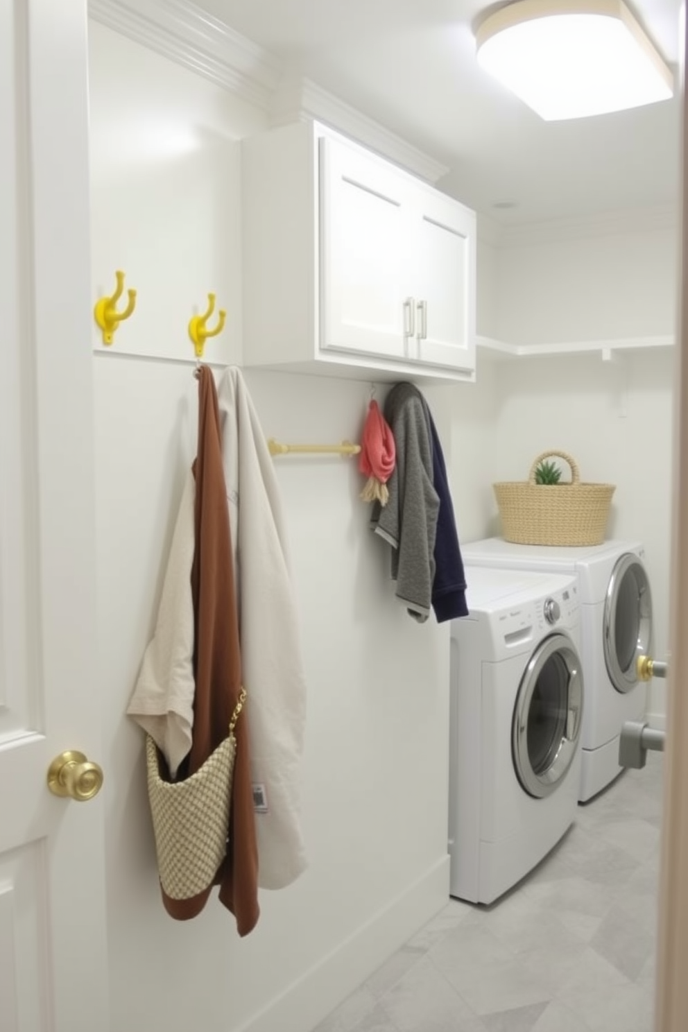 A bright and cheerful laundry room features yellow hooks for hanging items, adding a pop of color to the space. The walls are painted in a soft white, creating a fresh and airy feel, while the floor is adorned with light gray tiles for a modern touch.