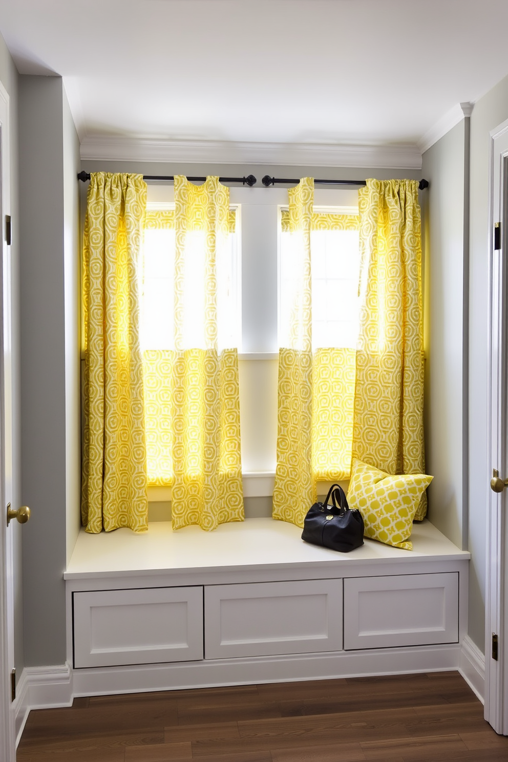 A bright and welcoming mudroom featuring yellow framed mirrors that reflect natural light. The space includes built-in benches with storage underneath and hooks for coats, all accented by cheerful yellow and white color schemes.