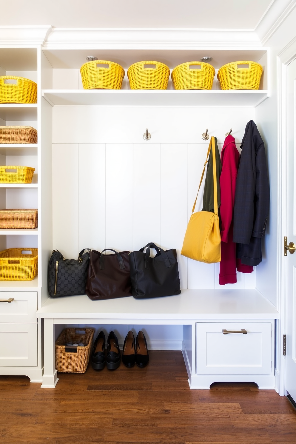 A bright and inviting mudroom featuring a yellow and gray color scheme. The walls are painted in a cheerful yellow, while the cabinetry is a sleek gray, providing a modern contrast. The space includes built-in benches with soft gray cushions and hooks for coats above. A patterned gray and yellow rug adds warmth and ties the design together.