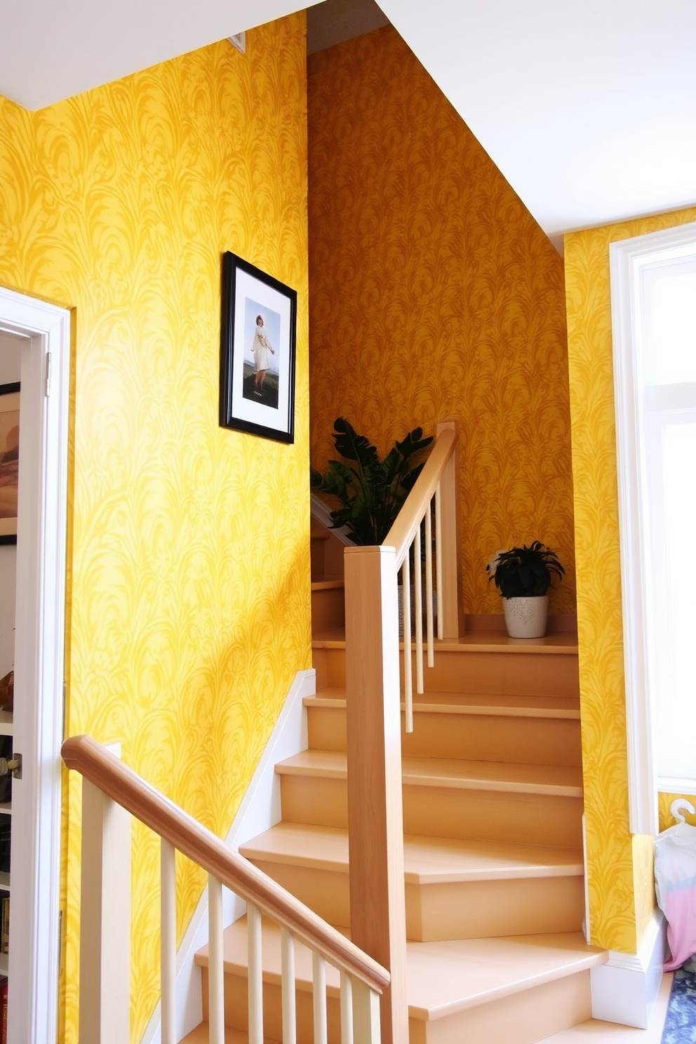 Cheerful yellow wallpaper adorns the staircase wall creating a bright and inviting atmosphere. The staircase features a sleek wooden railing and light-colored steps that complement the vibrant wallpaper. The design includes decorative elements such as framed artwork and potted plants on each landing. Soft natural light filters in through a nearby window, enhancing the cheerful ambiance of the space.