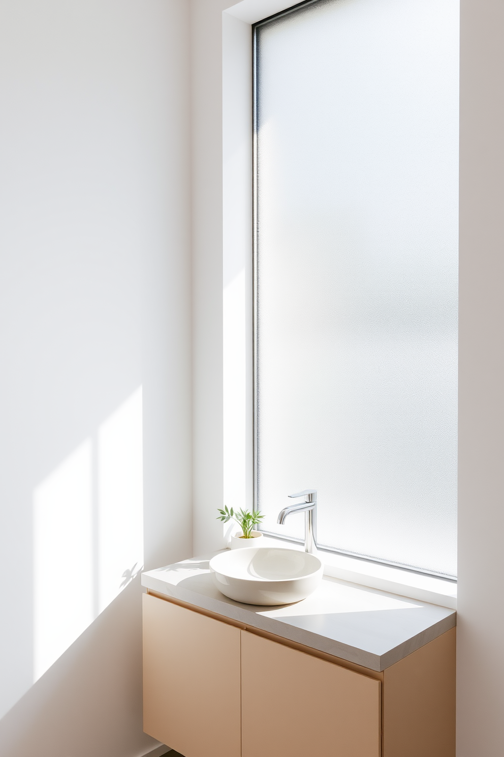 A minimalist vanity with clean lines sits against a backdrop of soft white walls. The countertop is made of smooth stone, featuring a single vessel sink and a sleek wall-mounted faucet. Natural light floods the space through a large frosted window, enhancing the serene atmosphere. A few carefully chosen plants are placed on the vanity, adding a touch of greenery to the calm environment.